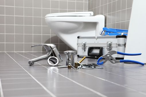 Professional plumbers tools for toilet installation during bathroom fitting in Redditch