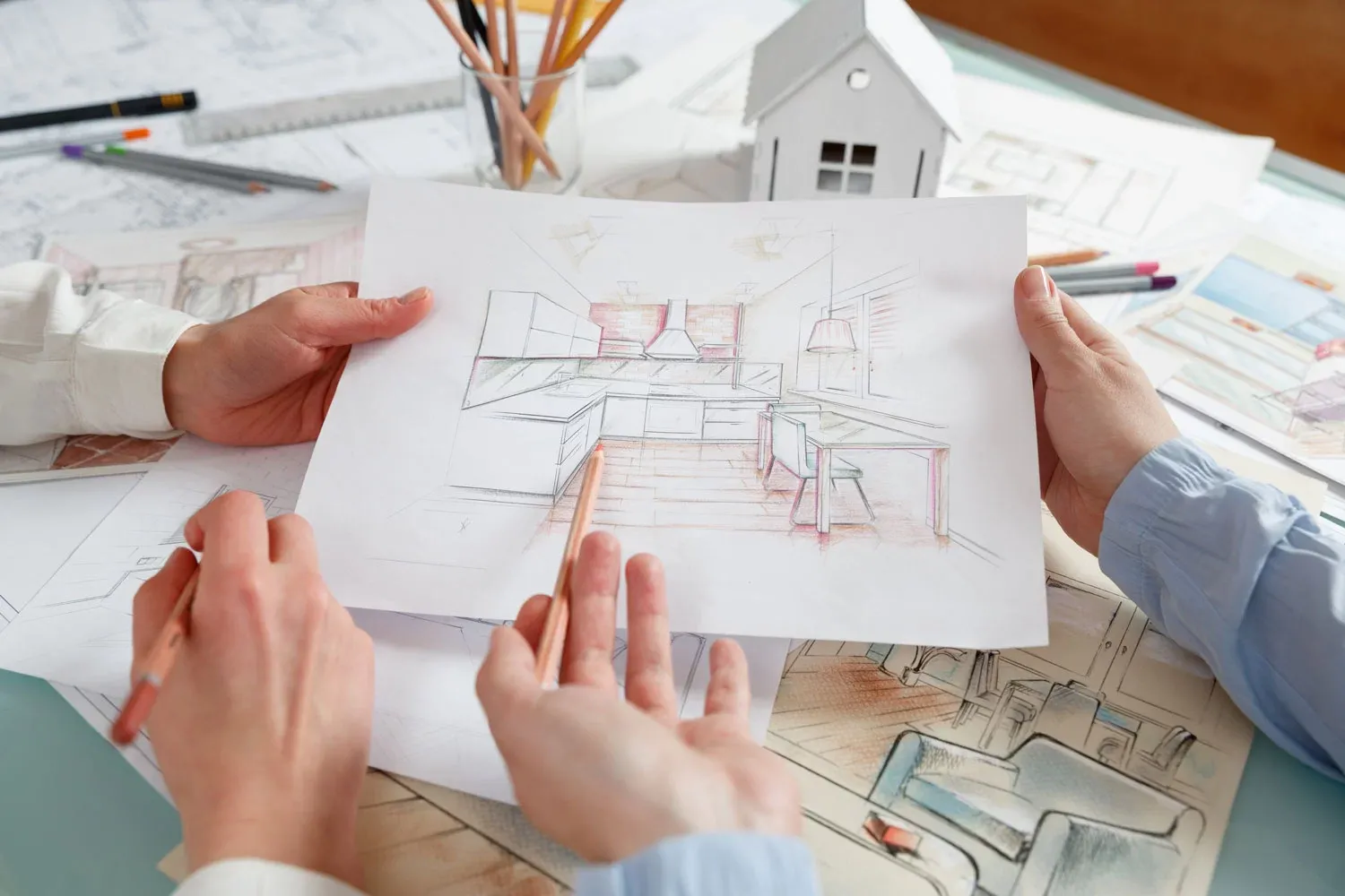 Kitchen designer discussing plans and asking questions during client consultation