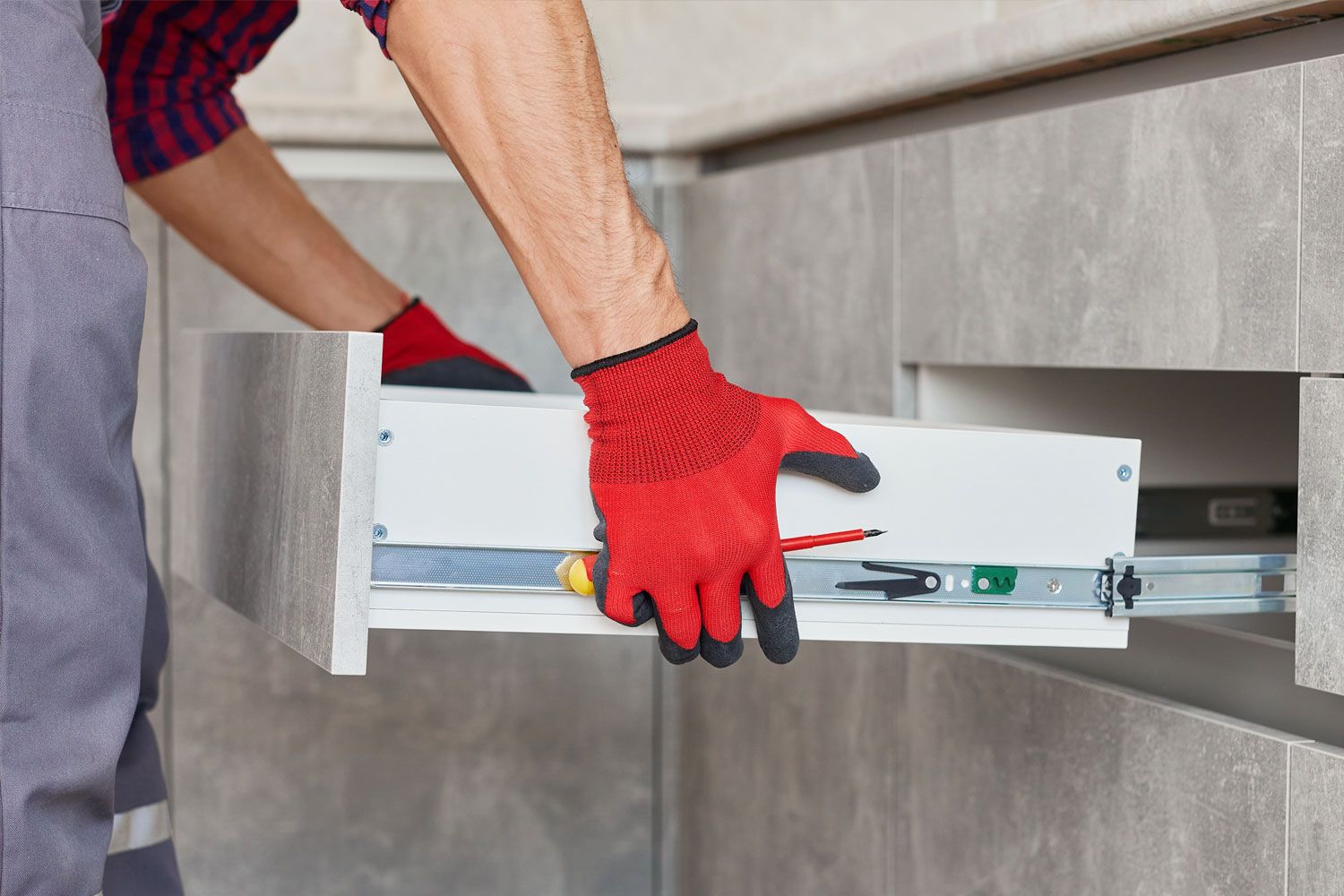 Professional kitchen installation in Redditch showing expert fitting of kitchen drawers.